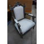 A French style carved beech and upholstered fauteuil