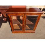 A Victorian figured walnut two door pier cabinet, 91cms h, 94cms w, 43cms d