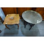 A brass topped folding occasional table, a mahogany oval coffee table and another occasional table