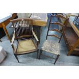 An Arts and Crafts mahogany armchair and a rush seated beech ladderback chair