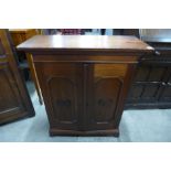 An oak two door table top cabinet