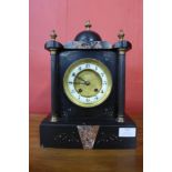 A 19th Century French Belge noir mantel clock, 33cms h