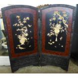 An oriental carved and black lacquered inlaid folding screen, 182cms h x 170cms w