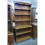 An Ercol Golden Dawn ash bookcase