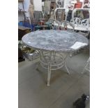 A wrought iron based garden table