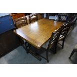 An oak draw-leaf refectory table, four ladderback chairs and a carved oak linenfold dresser