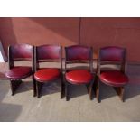 A set of four Art Deco oak and red leather chairs