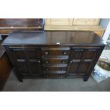 An Ercol dark elm dresser