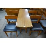 A teak drop-leaf table and four chairs