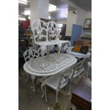 A cast alloy garden table and six chairs