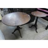 A George III oak tripod table and a mahogany tripod table