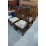 A set of four carved oak dining chairs