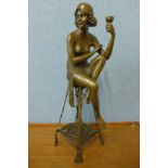 An Art Deco style bronze figure of a seated lady, manner of Auguste Moreau, 55cms h