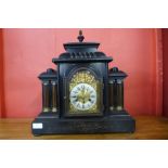 A 19th Century German ebonised architectural cased mantel clock, 47cms h
