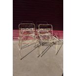 A set of four Victorian painted wrought iron garden chairs