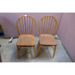 A pair of Victorian style beech kitchen chairs