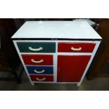 A painted metal kitchen cabinet