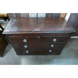 A steamer trunk and a stained pine chest of drawers