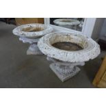 A pair of Victorian painted cast iron campana shaped garden urns, 43cms h x 60cms d