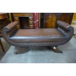 A Regency style mahogany and brown leather window seat, 59cms h x 125cms w