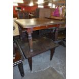 A Victorian oak dining table and a mahogany dining table