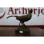 A French style bronze figure of a pheasant, on black marble socle, 30cms h