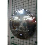 A circular bevelled edge mirror, 50cms d