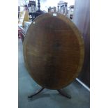 A Regency mahogany oval tilt-top loo table