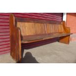 A pine church pew, 91cms h x 214cms w