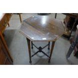 An Arts and Crafts walnut octagonal occasional table