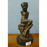 A bronze figure of a boy, on black marble socle, 29cms h