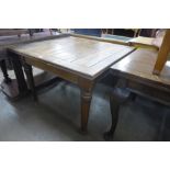 An oak draw-leaf table