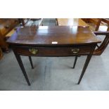 A George III mahogany single drawer bow front side table, 70cms h, 74cms w, 36cms d