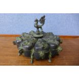 An oriental bronze opium box, 14cms h x 19cms d