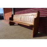 A pine church pew, 91cms h x 214cms w