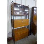 A Staples teak Ladderax room divider, with five extra metal side pieces