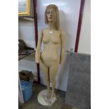 A female shop mannequin on stand