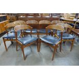 A set of eight Danish Kai Kristiansen teak and black vinyl Fire chairs