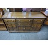 An Ercol Golden Dawn elm and beech sideboard