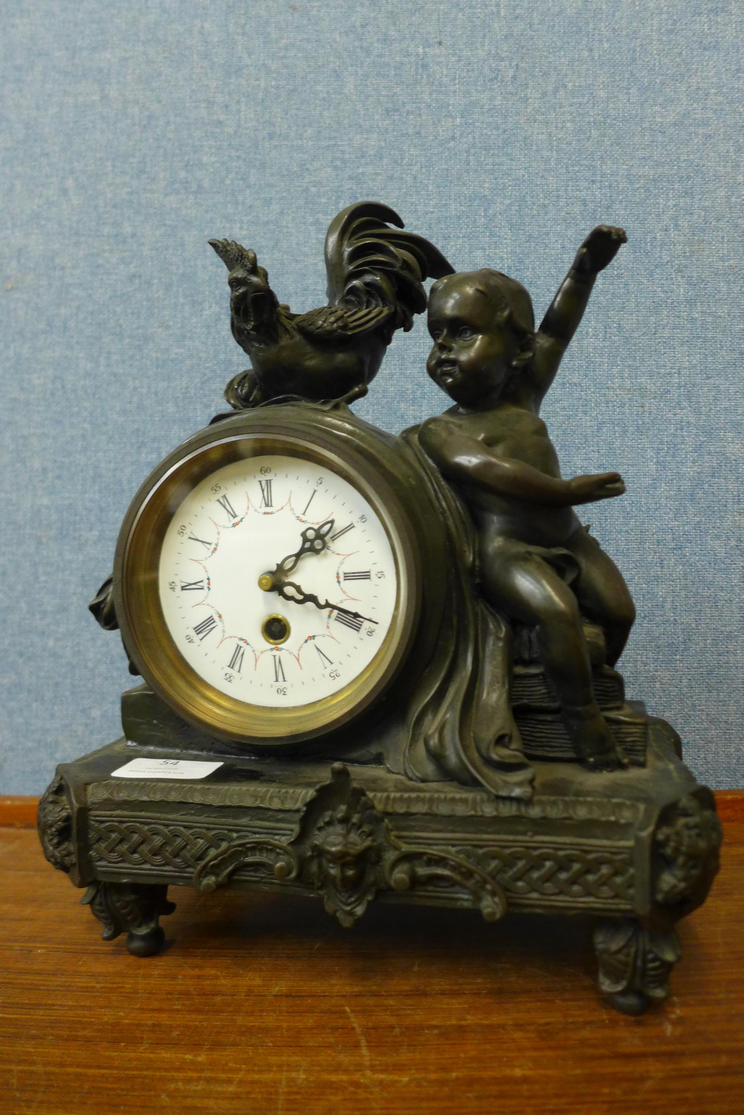 A French style bronze mantel clock, 32cms h