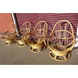 A set of four bamboo and cane revolving chairs