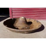 A cast iron Mexican hat pig feeder