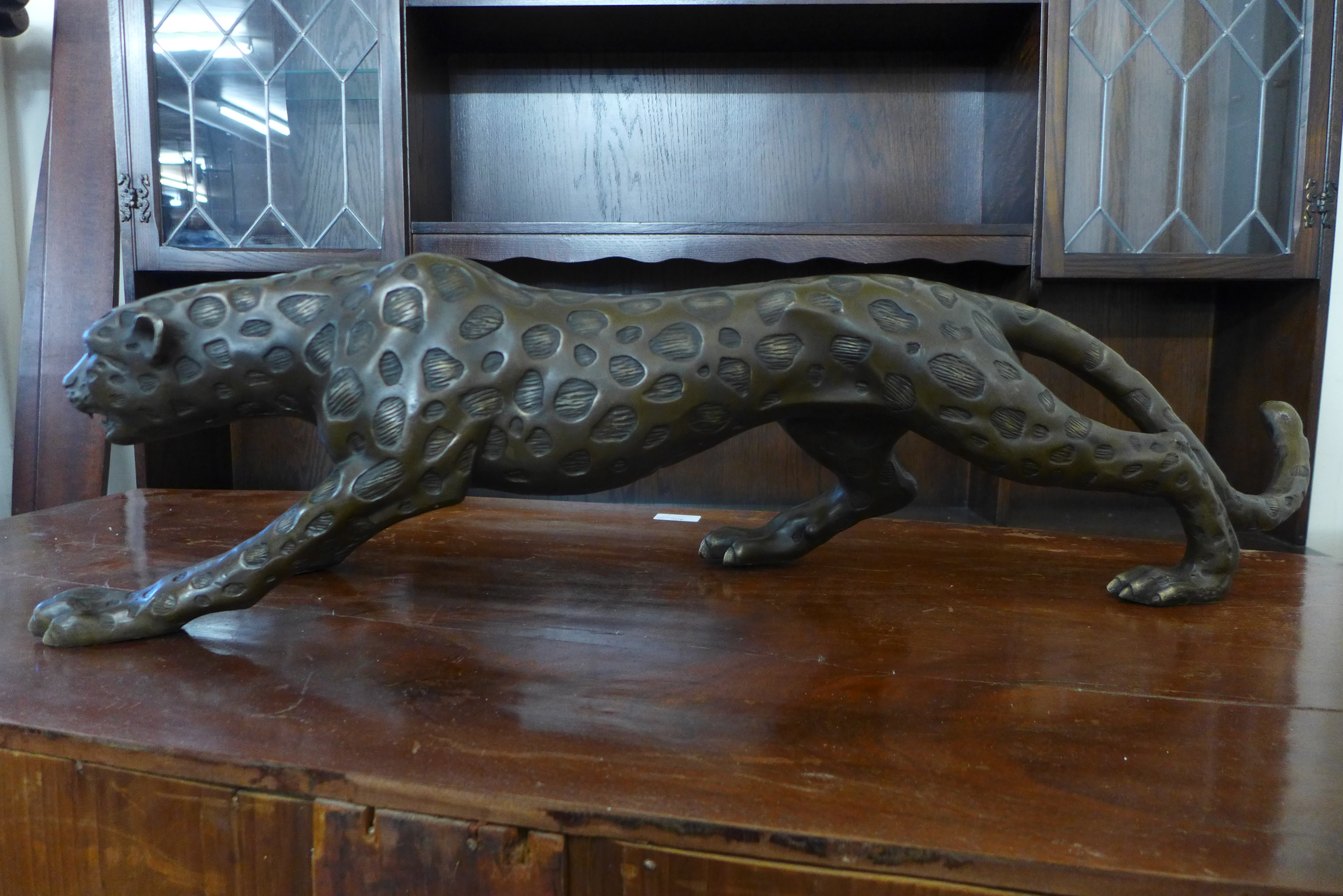 A bronze figure of a crouching leopard, 21cms h x 79cms l - Image 2 of 2