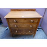 A Victorian walnut and satin birch chest of drawers