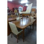 A Robert Heritage teak dining table and four chairs