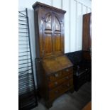 A George II oak bureau bookcase, 204cms h, 76cms w, 49cms d