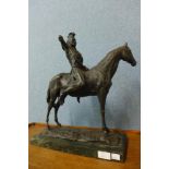 A bronze figure of a native American on horseback, on green marble socle, 47cms h