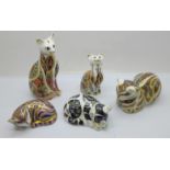 Five Royal Crown Derby cat paperweights including Collectors Guild Misty, two with gold stoppers