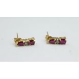 A pair of ruby and diamond earrings, marked 10K