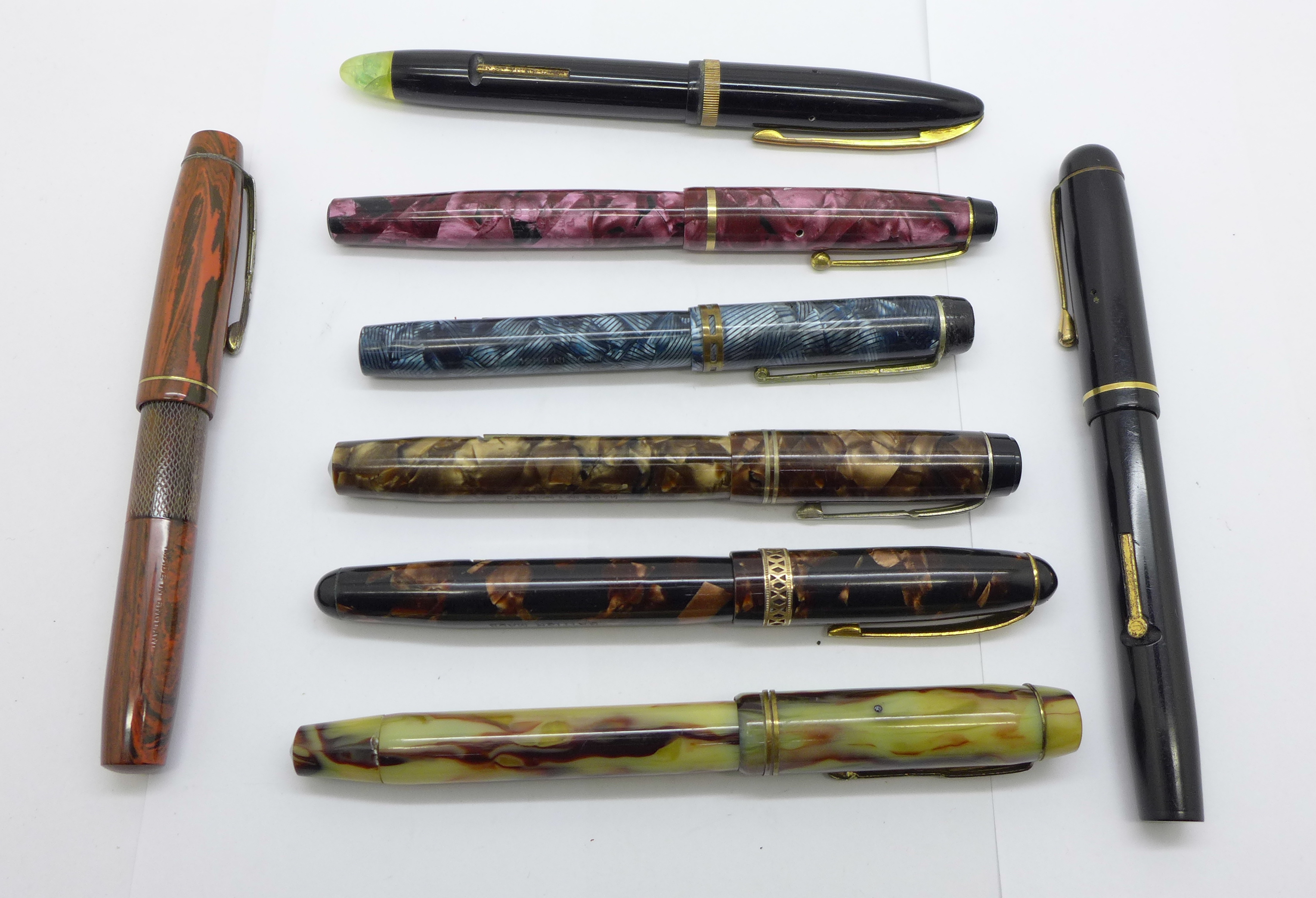 A collection of eight pens including 2x Unique, Wyvern and Mentmore, all eight with 14ct gold nibs